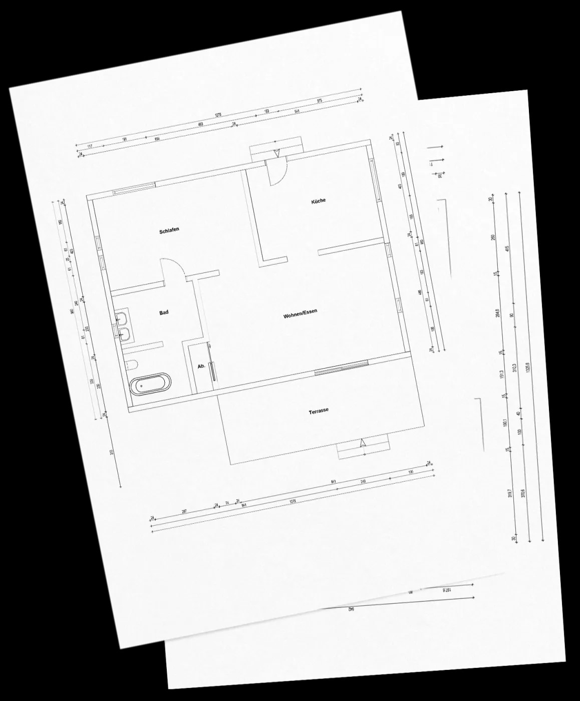 Schräg liegende Nahansicht des bemaßten Grundrisses einer 2-Zimmer Wohnung mit Terasse.
